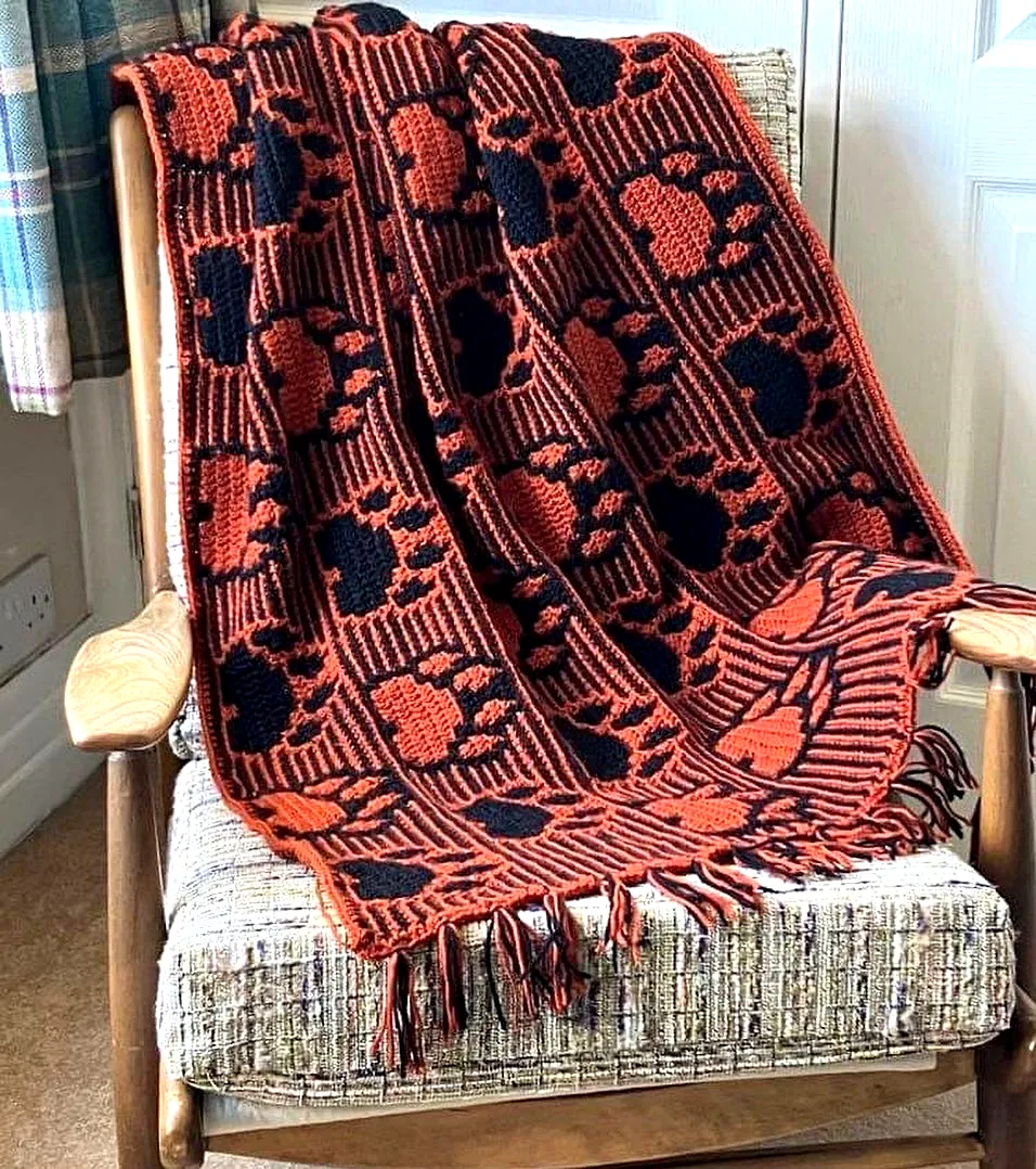 Cozy Crochet Pet Blanket in Black and Orange with Paw Print