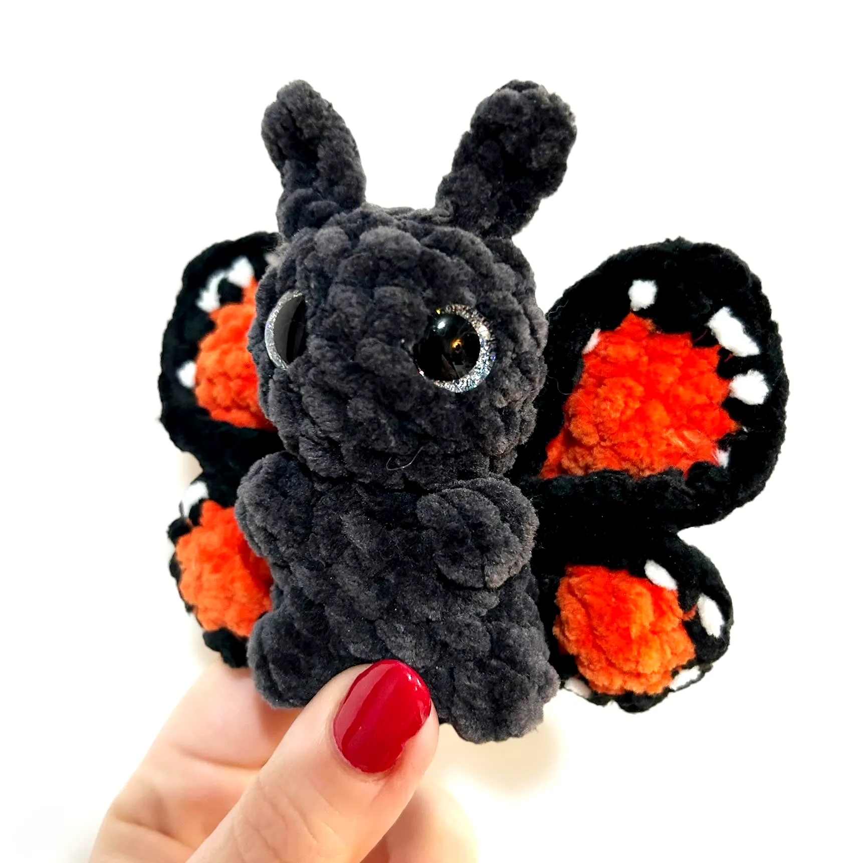 Crochet Butterfly in Vibrant Black Orange and White Plush Style