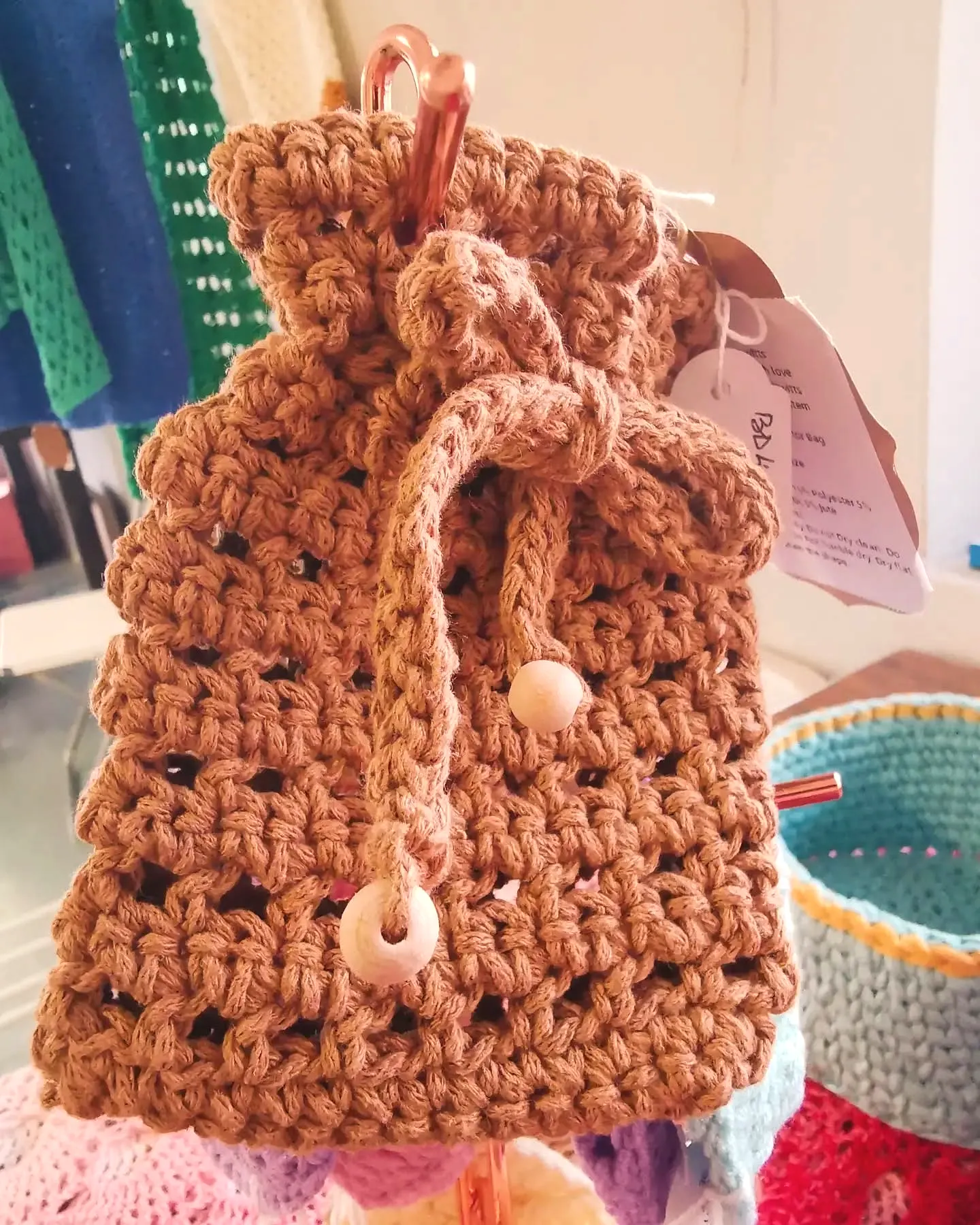 Cute brown crochet face scrubber for advanced beginners