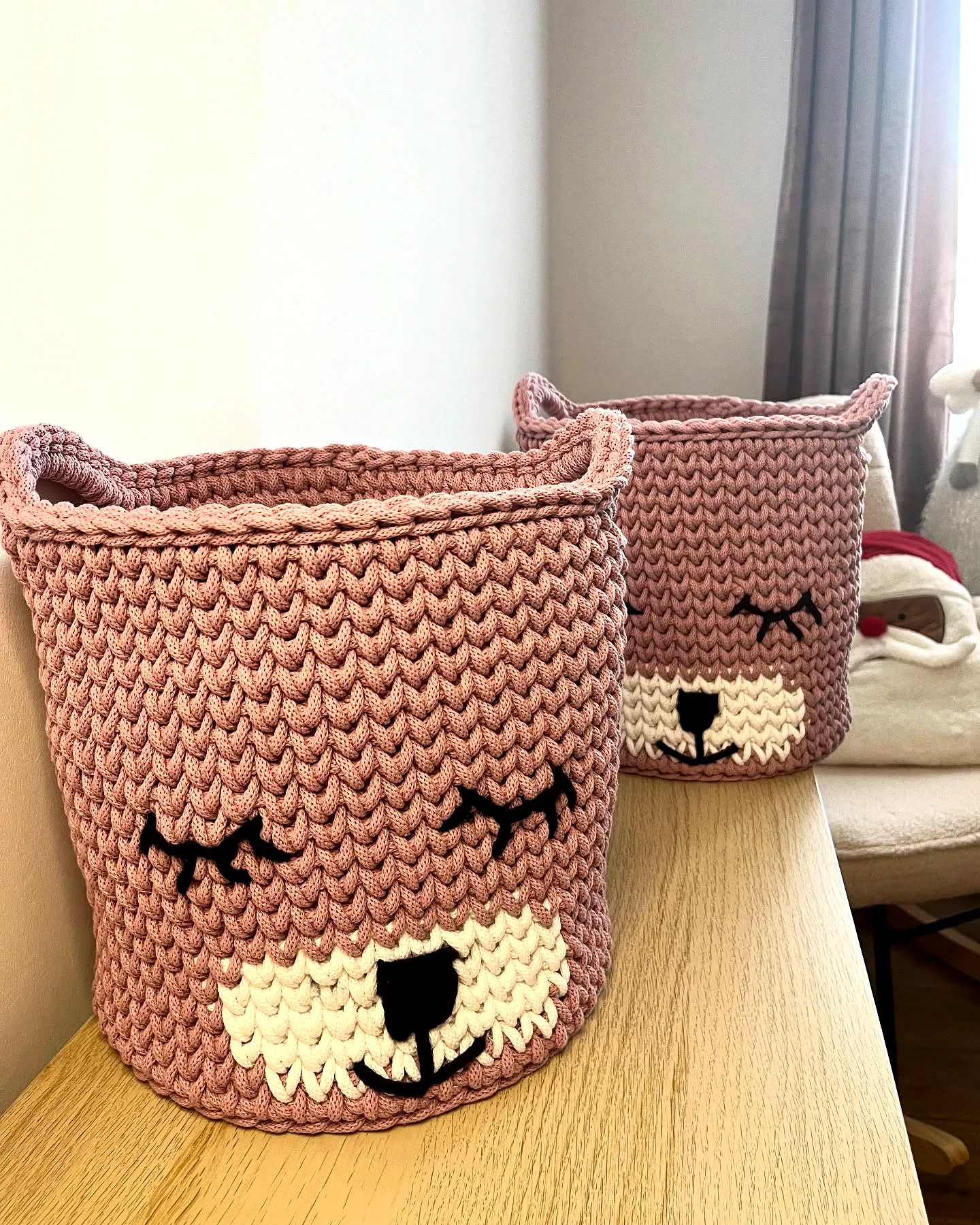 Cute crochet basket with bear design in soft pink yarn