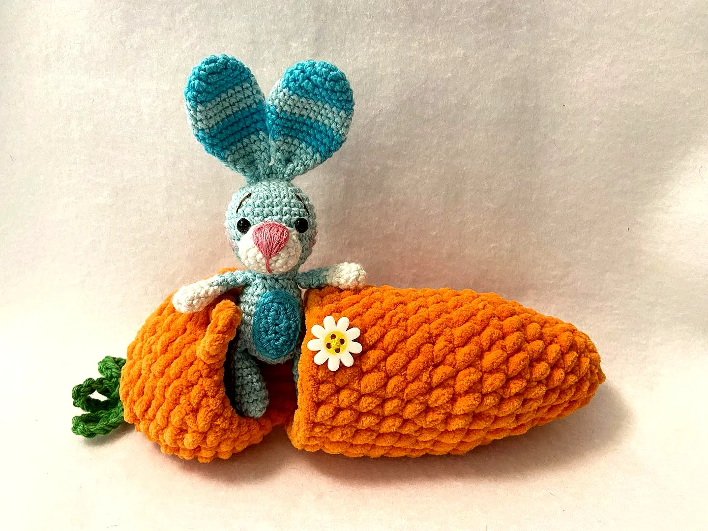 Cute crochet carrot in vibrant orange with a charming bunny