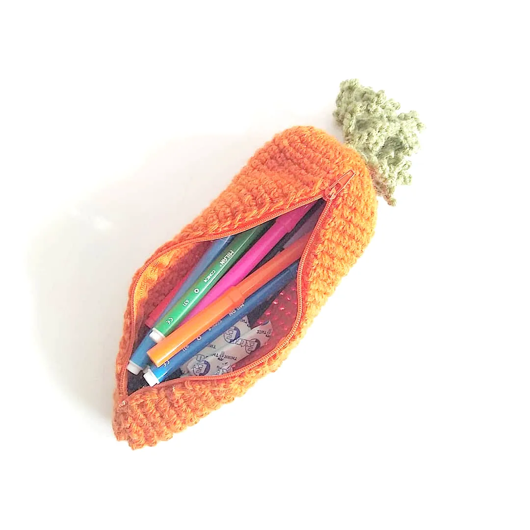 Cute crochet carrot pencil case in vibrant orange and green