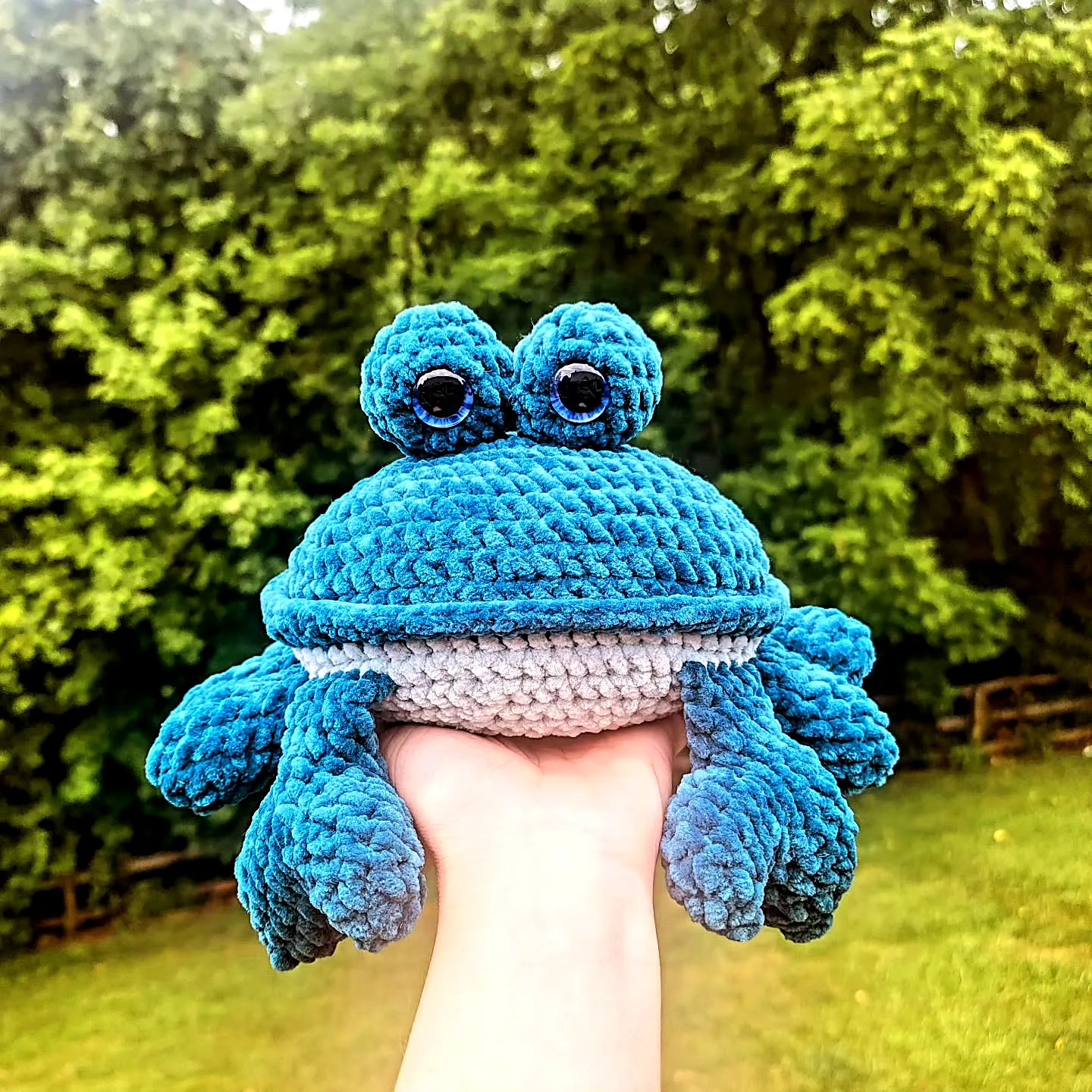 Cute crochet crab in vibrant blue and gray