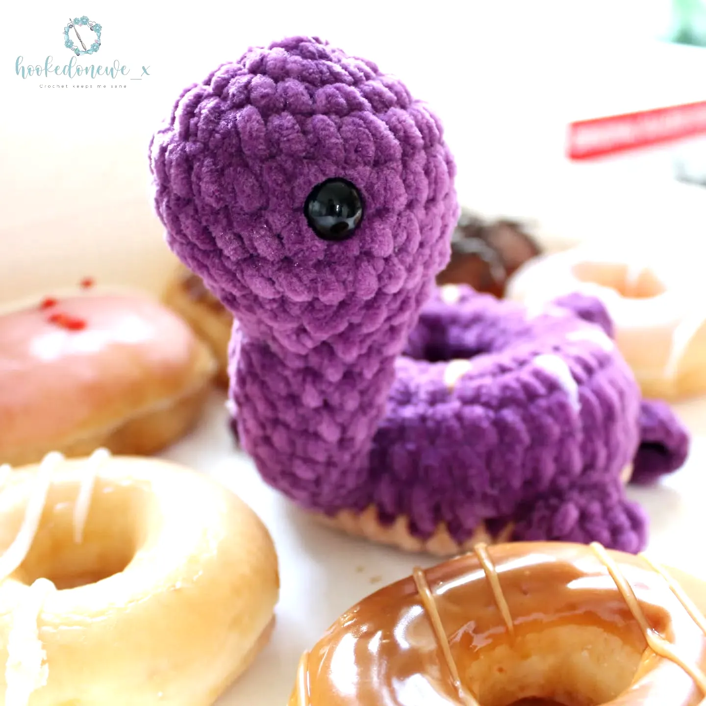 Cute crochet donut plush with colorful icing and playful design