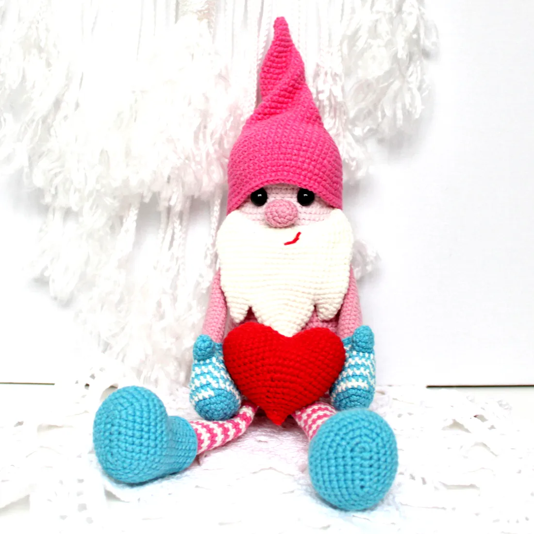 Cute crochet gnome with pink hat and blue accents