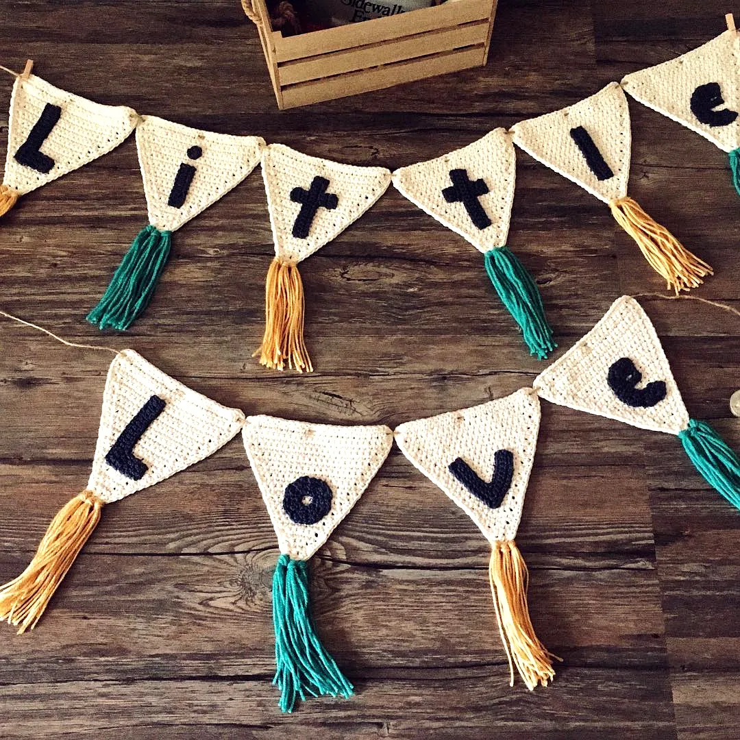 Cute Crochet Nursery Decor with Colorful Tassels and Banners