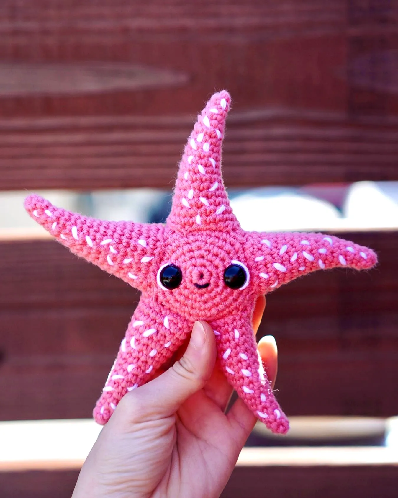 Cute easy crochet starfish in soft pink with playful design