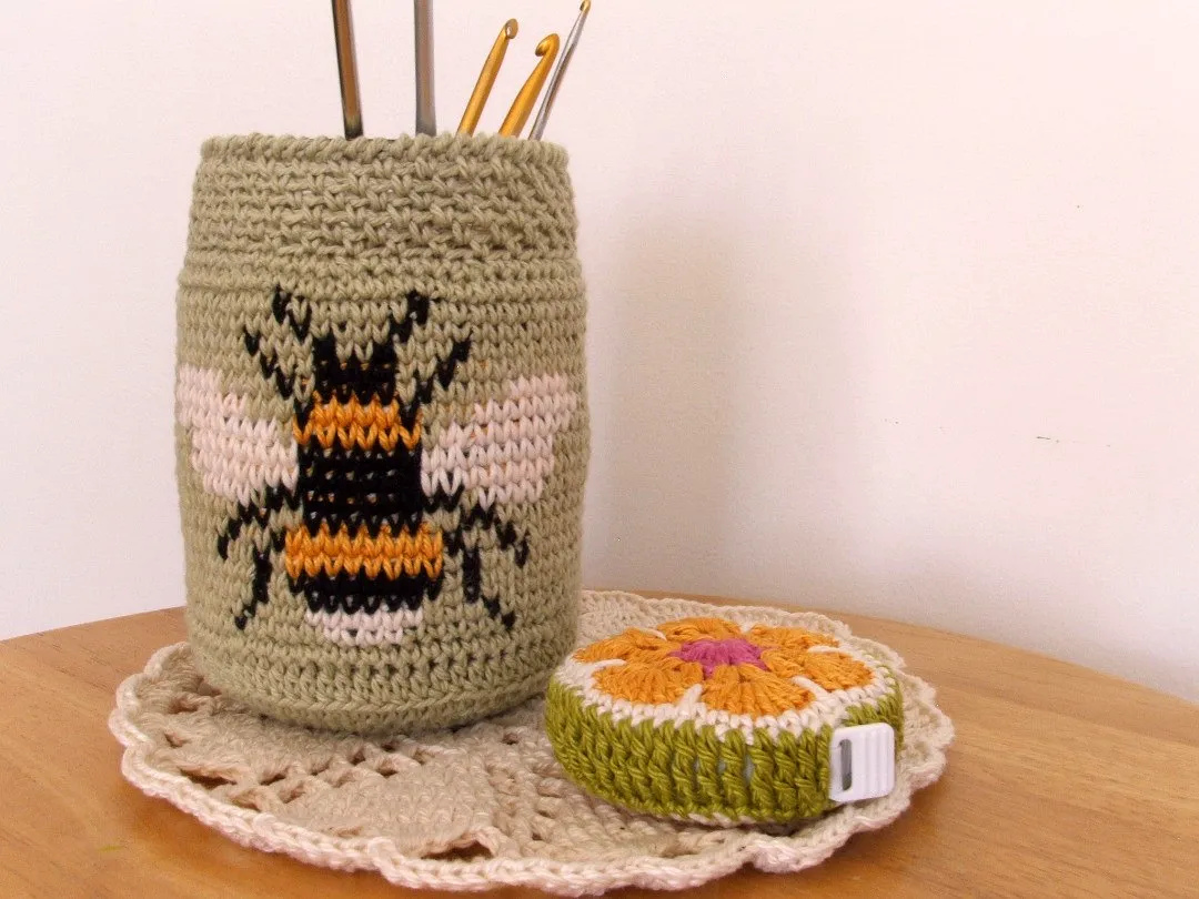 Cute light green crochet jar cover with adorable bee design
