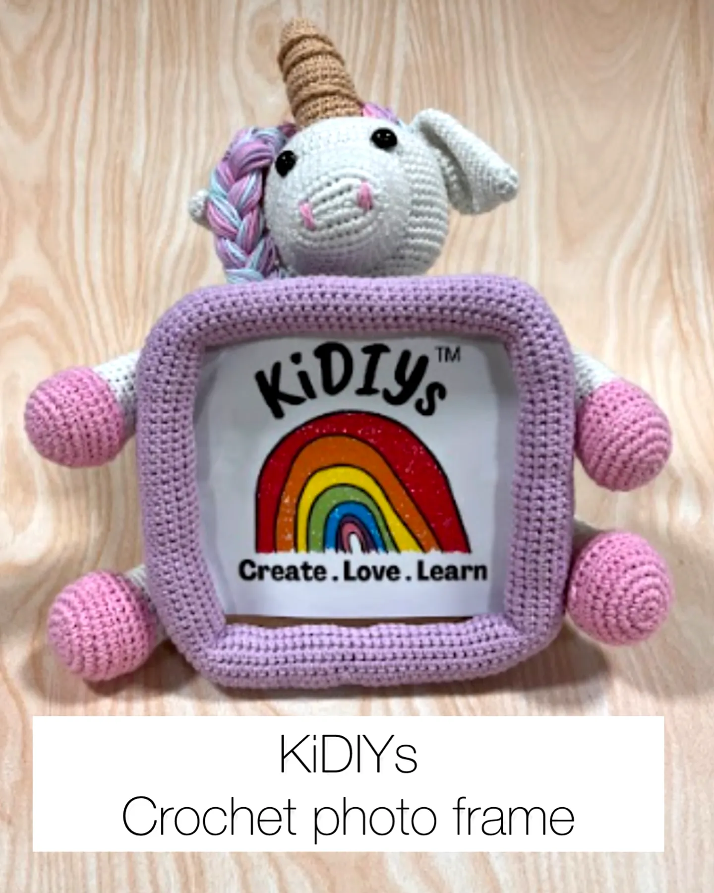 Cute pastel crochet toy unicorn photo frame for creatives