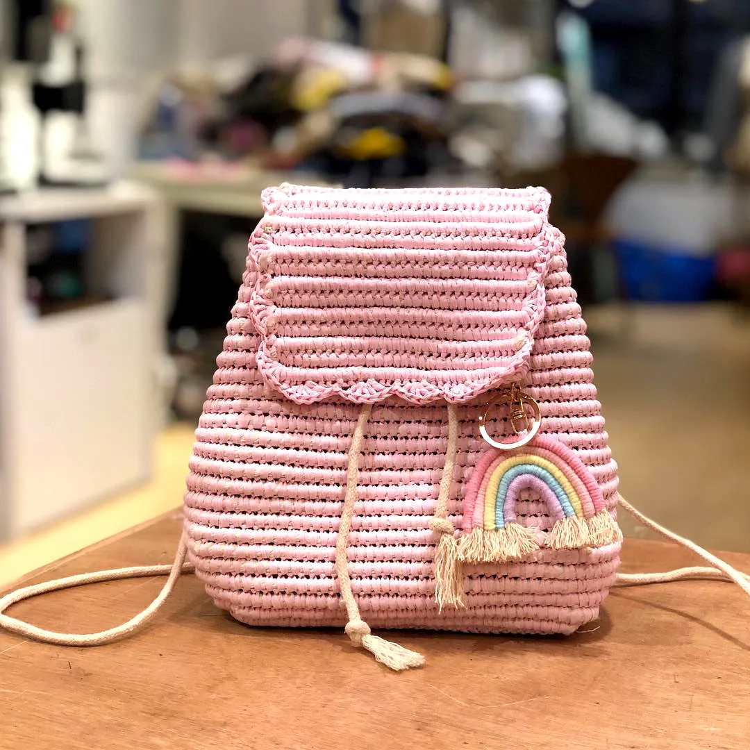 Cute pink crochet backpack with rainbow embellishment for intermediates