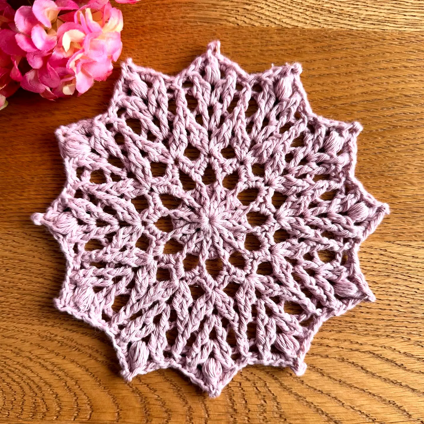 Delicate Pink Crochet Doily with Starburst Design