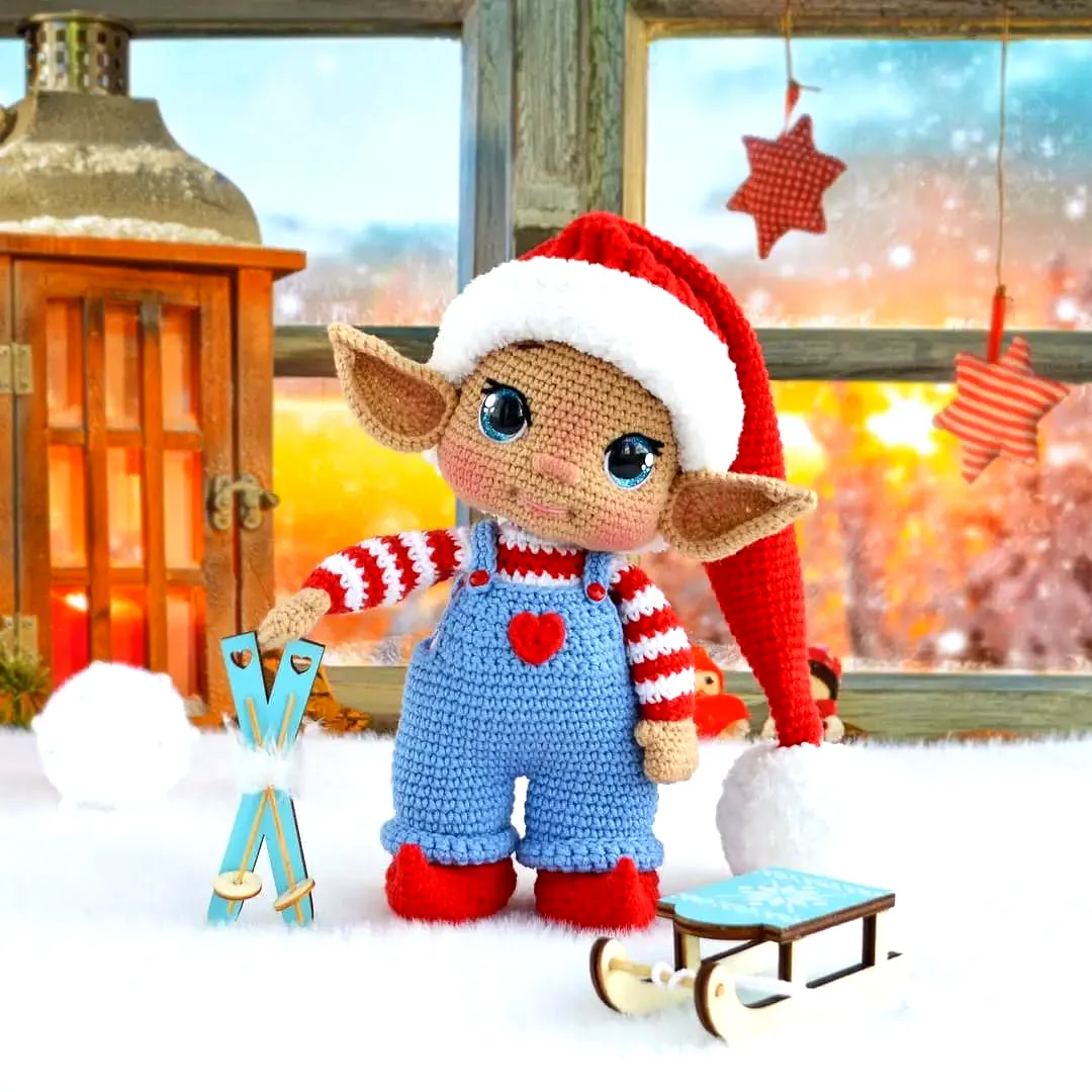 Delightful crochet elf in vibrant red and white festive style