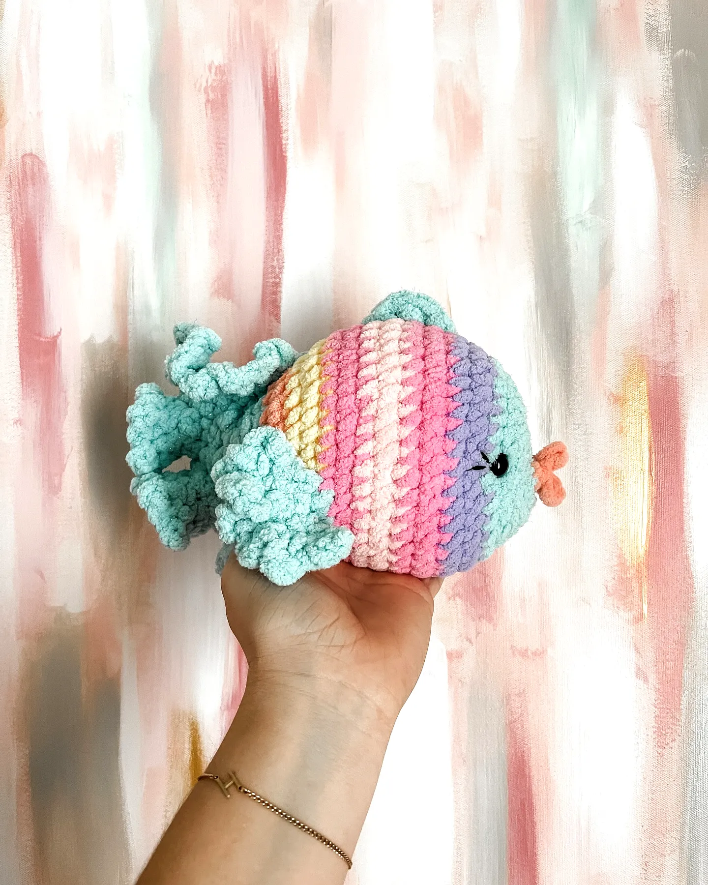 Delightful crochet fish in pastel pink and blue for intermediates