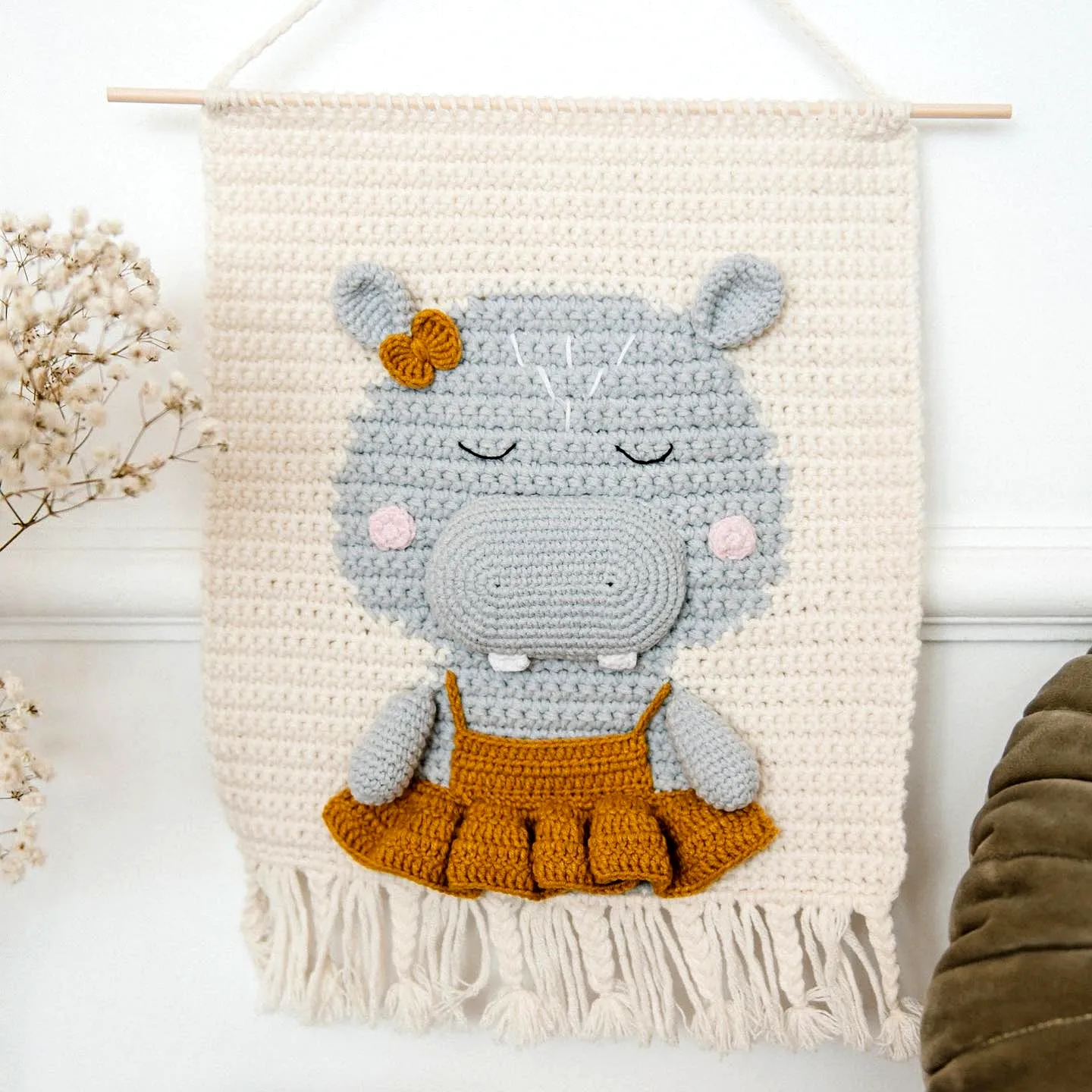 Delightful crochet nursery decor with a cute hippo in gray and yellow