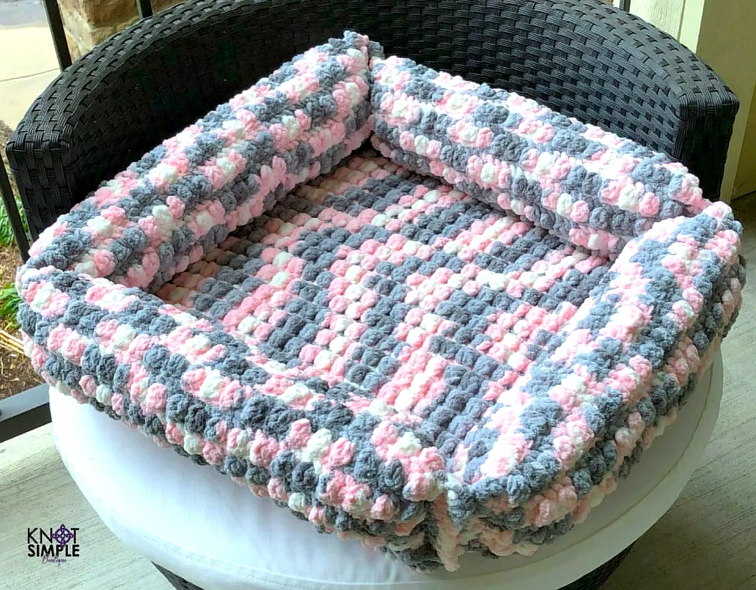 Delightful crochet pet bed in pink gray and white for pets