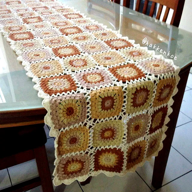 Elegant crochet table runner in warm patchwork colors
