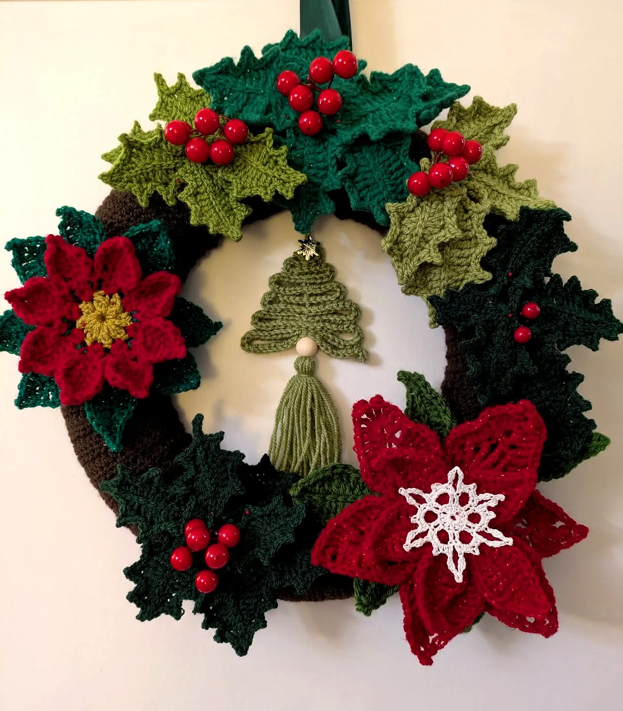 Festive Crochet Wreath with Vibrant Colors and Detailed Motifs