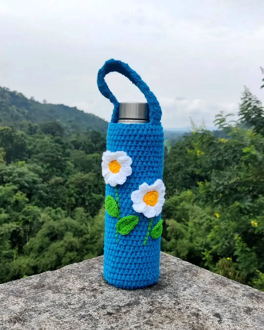 Vibrant Blue Crochet Bottle Cozy with Floral Motifs