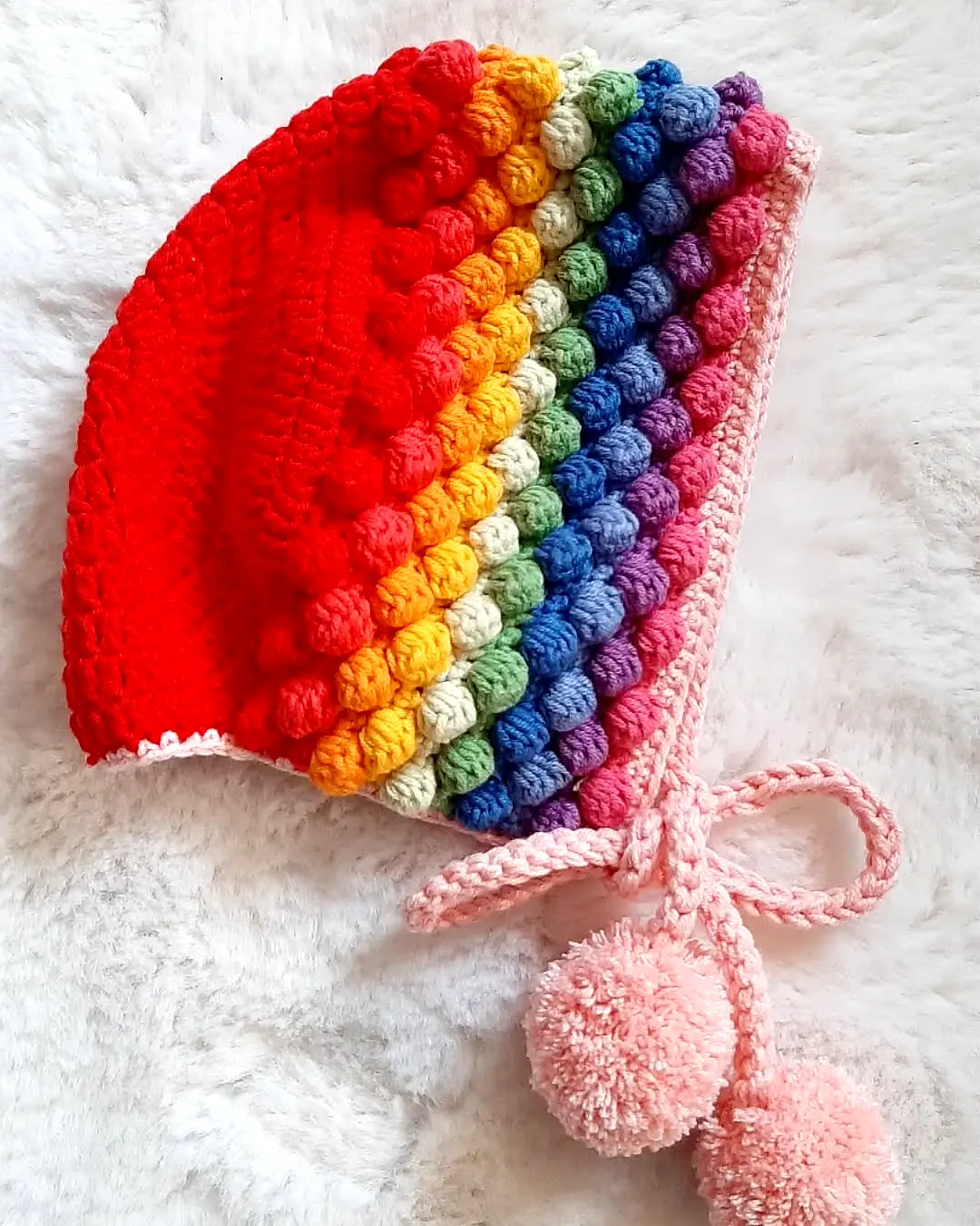 Vibrant Crochet Baby Bonnet with Charming Bobble Stitches