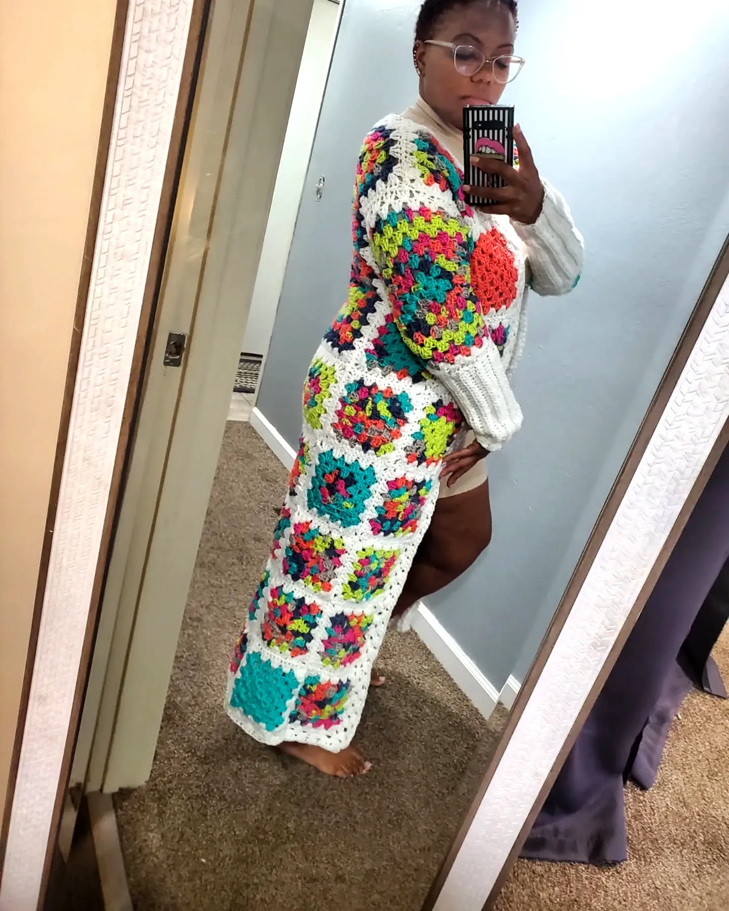 Vibrant crochet duster with colorful granny square design