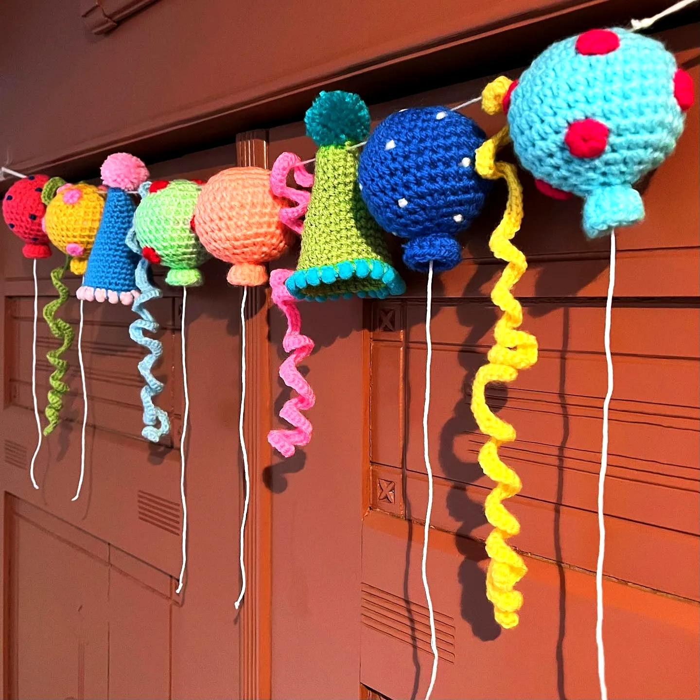 Vibrant Crochet Garland with Colorful Balloon and Bell Motifs