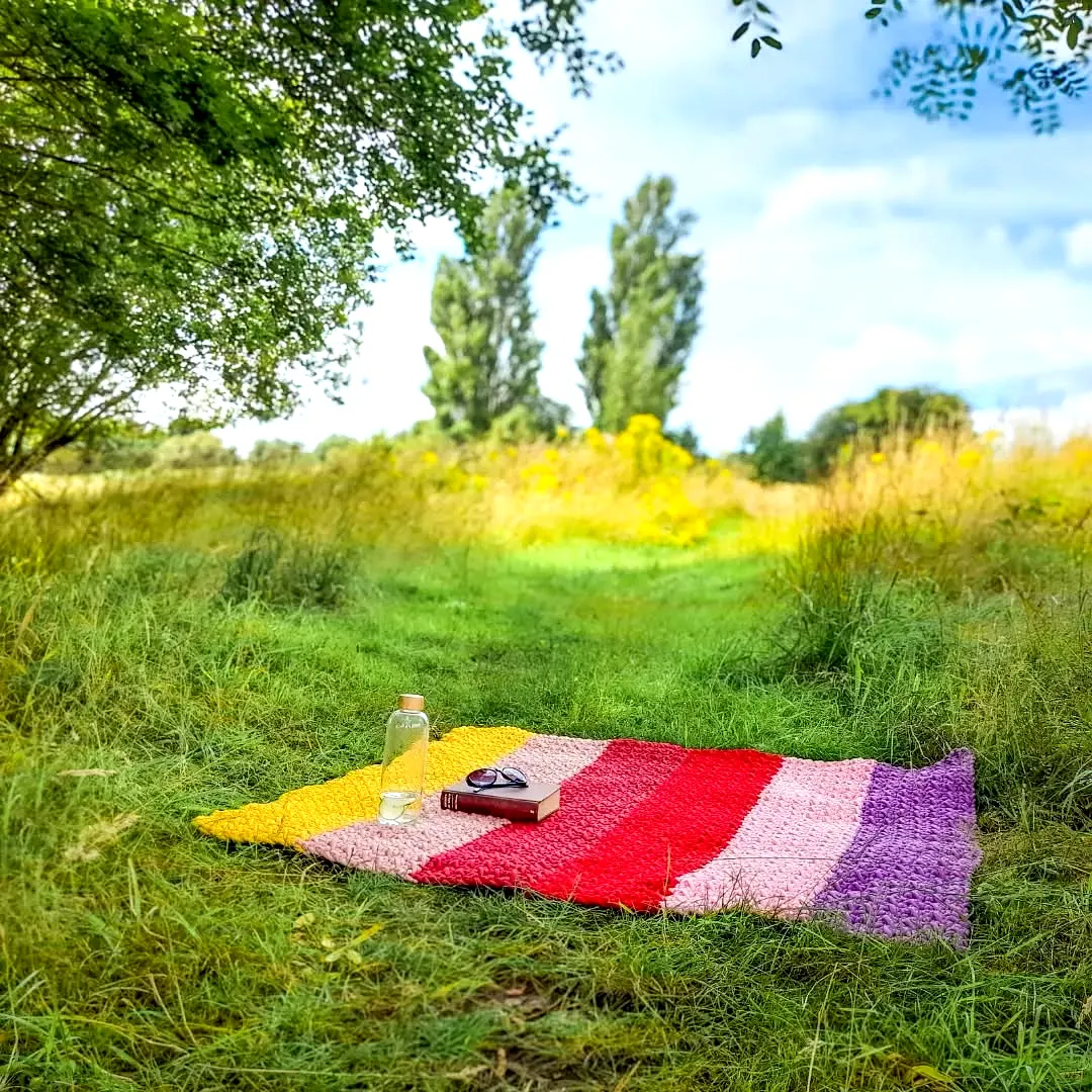 Vibrant Crochet Picnic Blanket in Colorful Striped Design