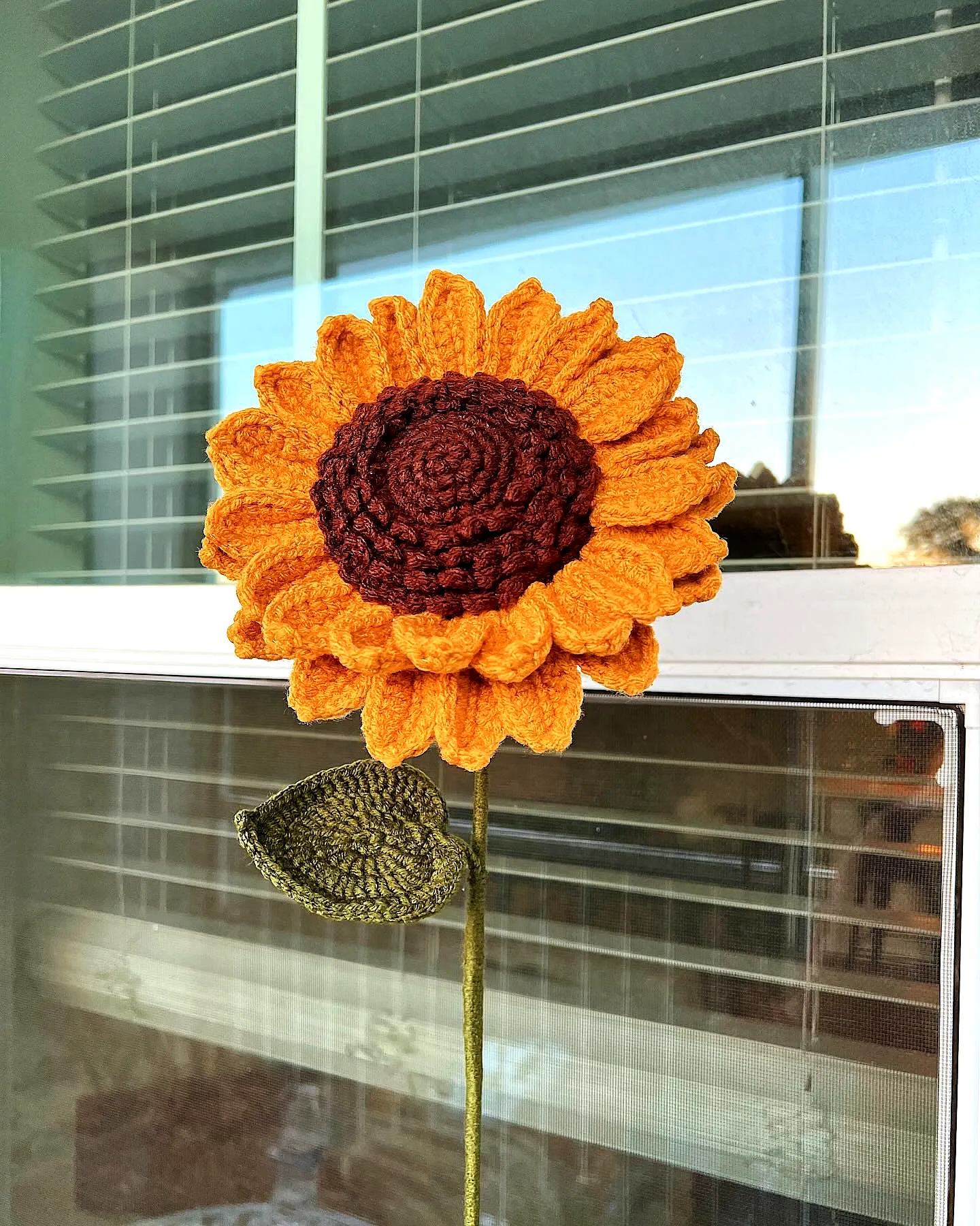 Vibrant Crochet Sunflower with Charming Green Leaf
