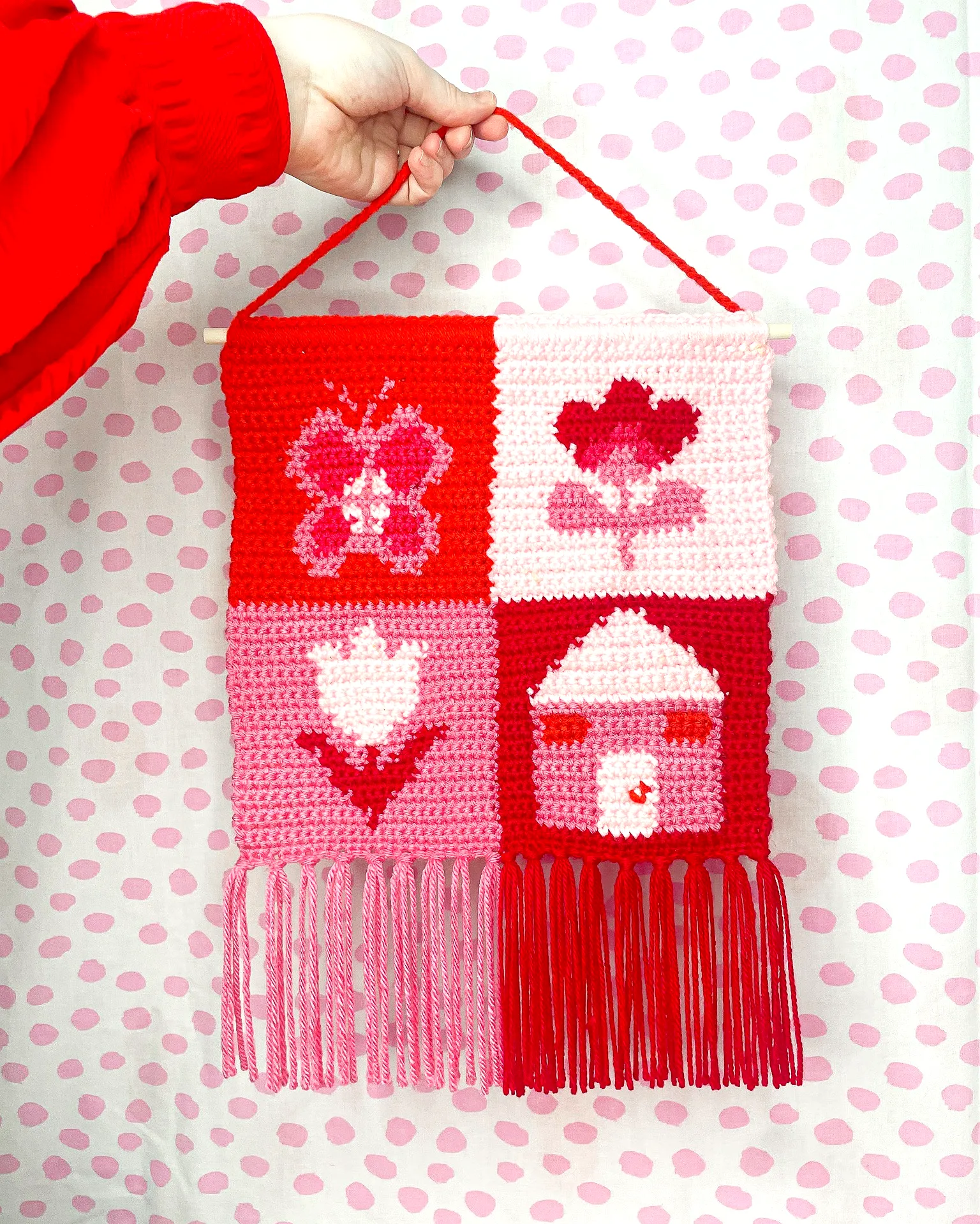Vibrant Crochet Wall Hanging with Hearts and Floral Motifs