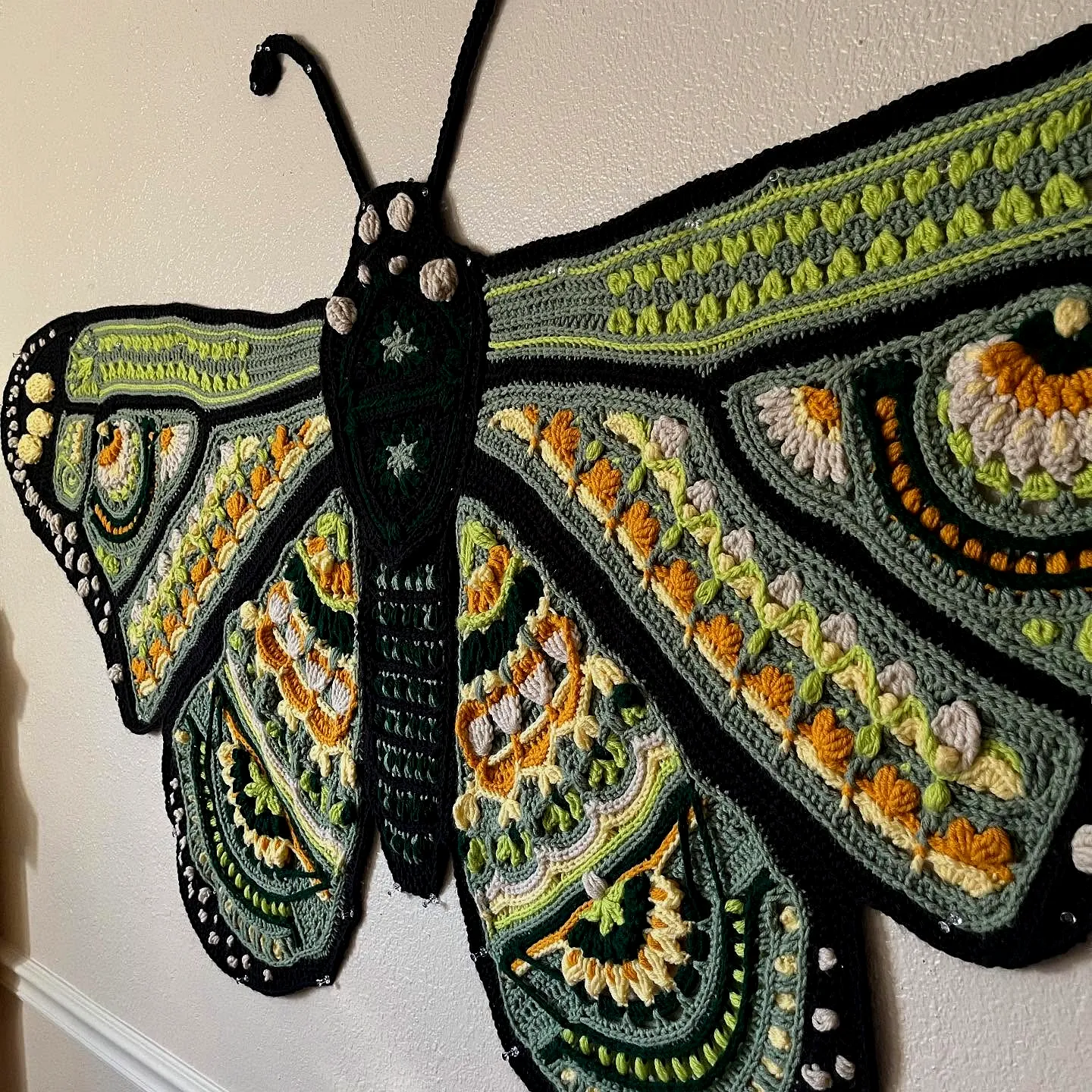 Vibrant Crochet Wall Hanging with Intricate Butterfly Design
