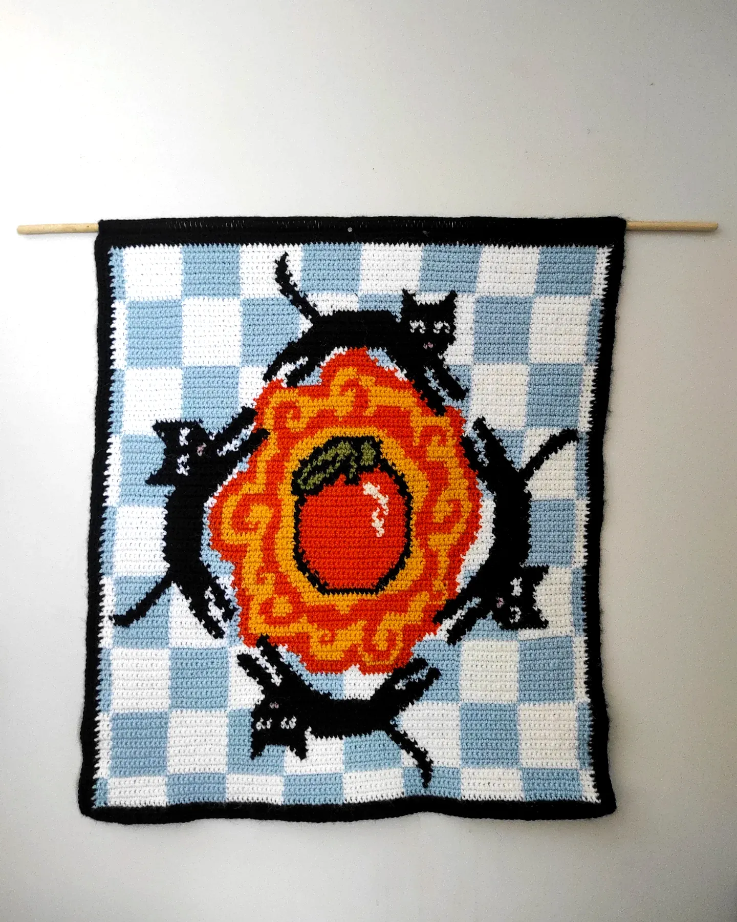 Vibrant Crochet Wall Hanging with Playful Black Cats in Colorful Style