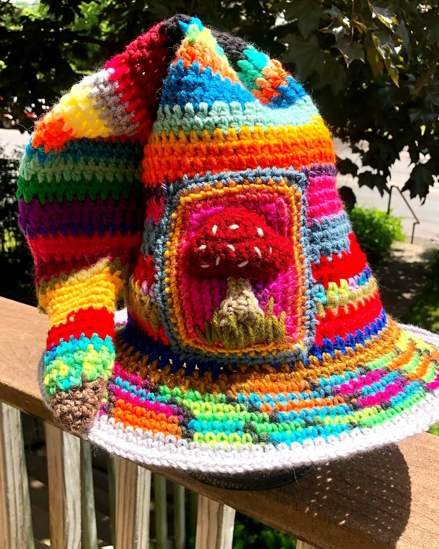Vibrant Crochet Wizard Hat with Colorful Stripes and Mushroom
