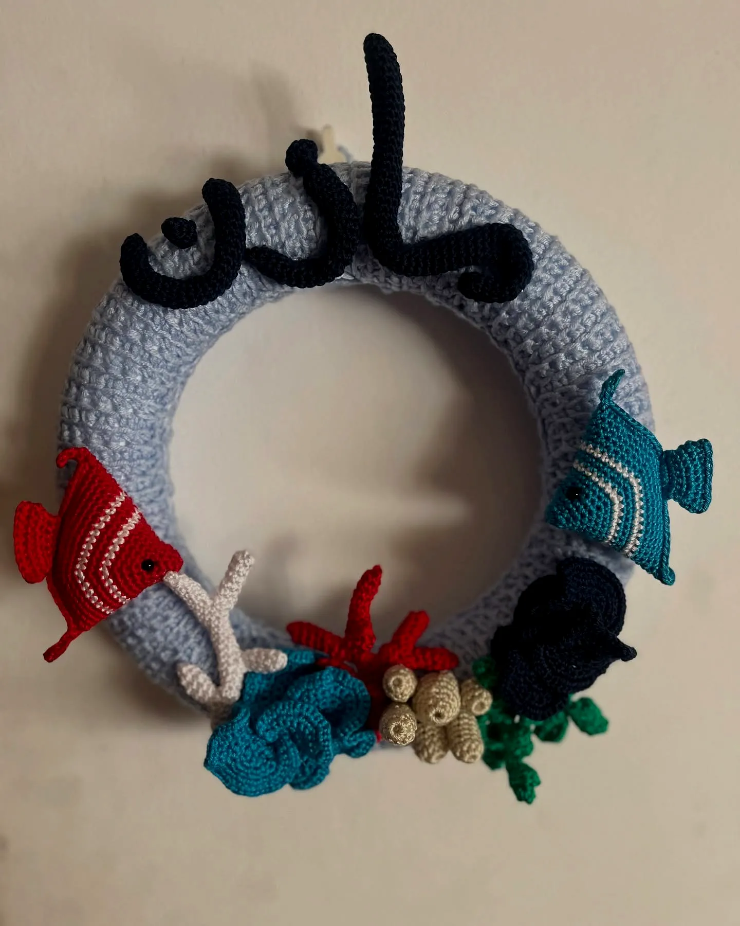 Vibrant Crochet Wreath with Colorful Fish and Floral Elements