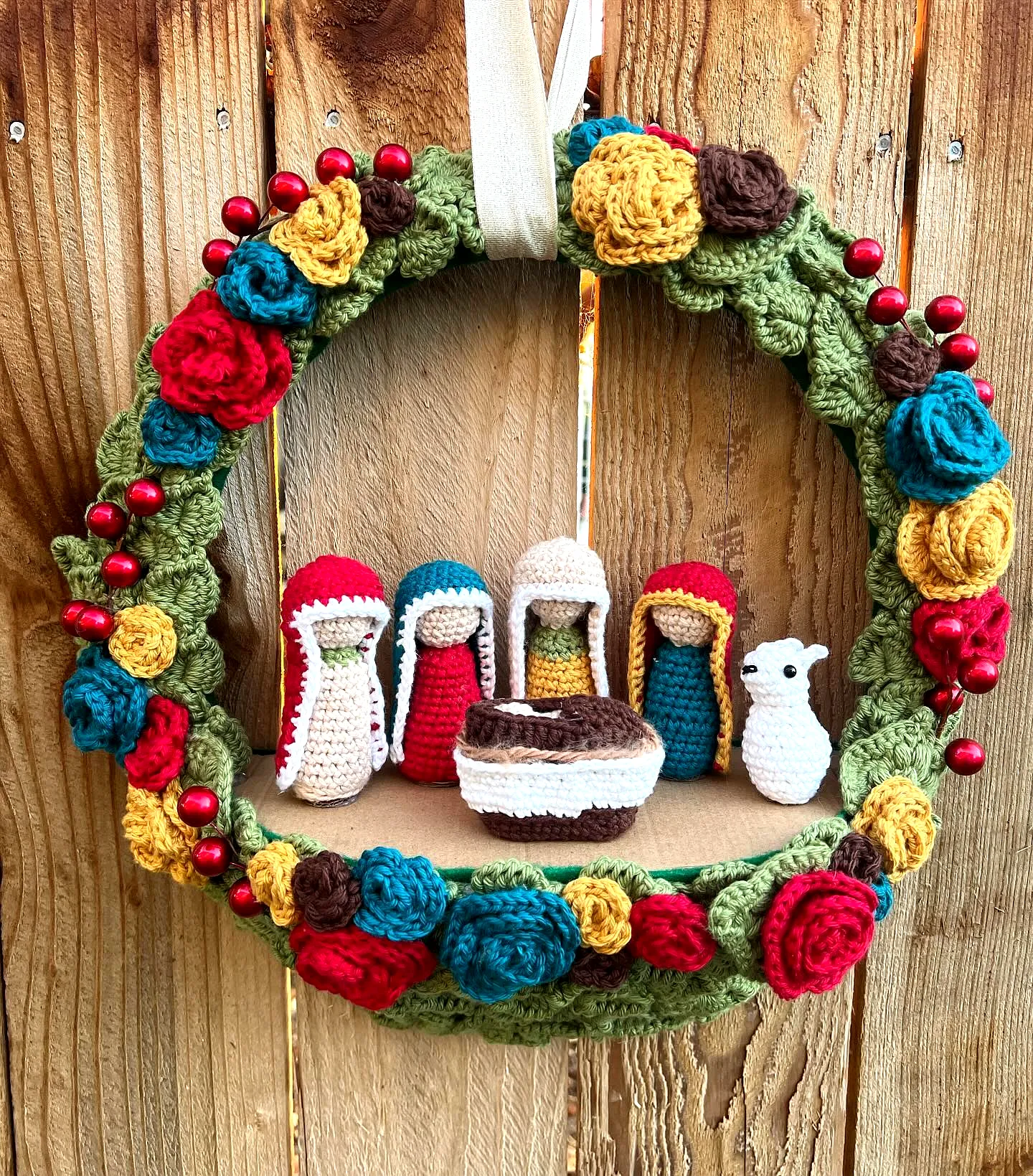Vibrant Crochet Wreath with Colorful Flowers and Berries