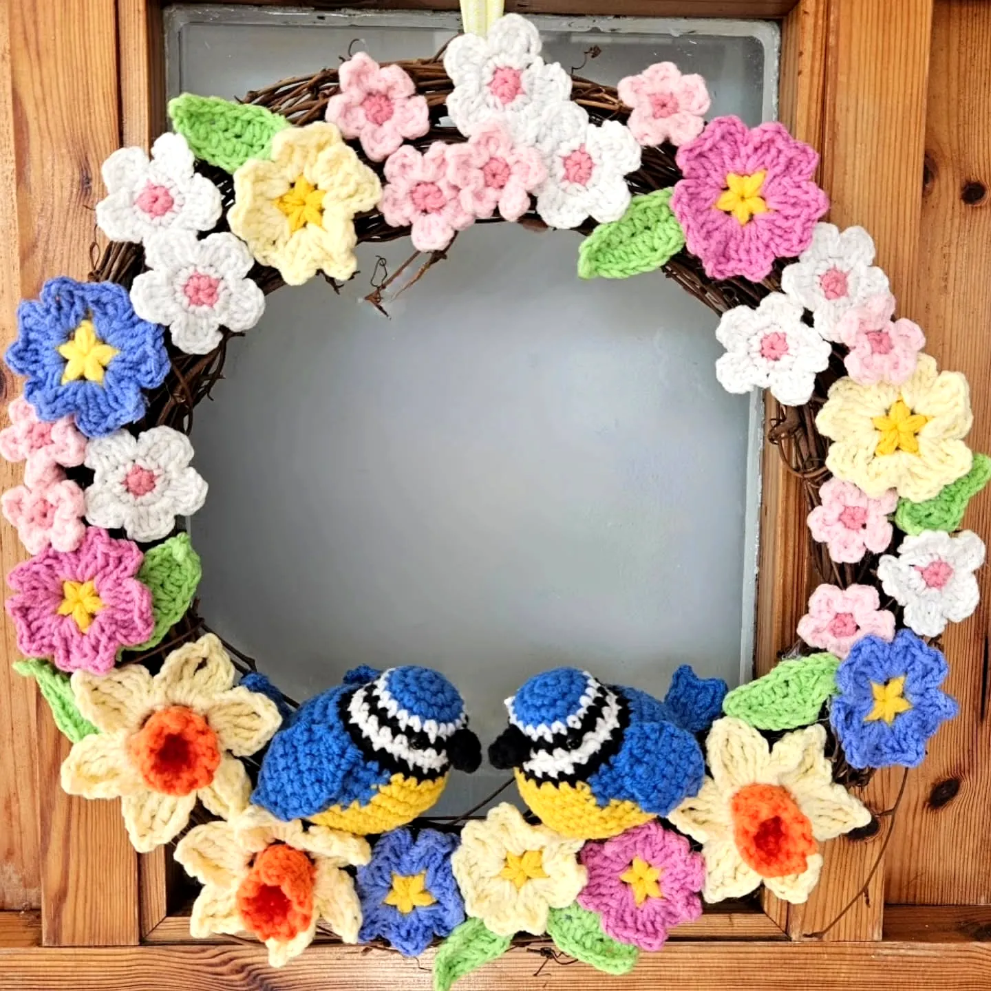 Vibrant Crochet Wreath with Flowers and Blue Tits