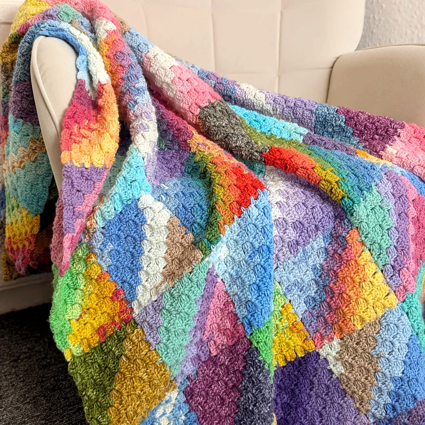 Vibrant Multi-Colored Crochet Throw in Textured Patchwork Design