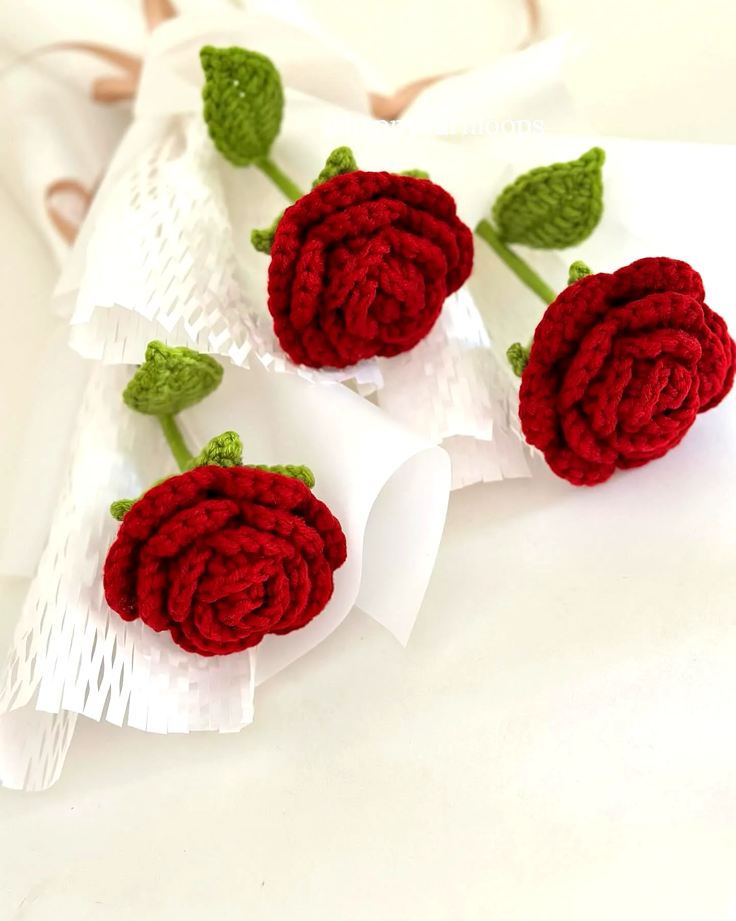 Vibrant Red Crochet Rose with Green Leaves