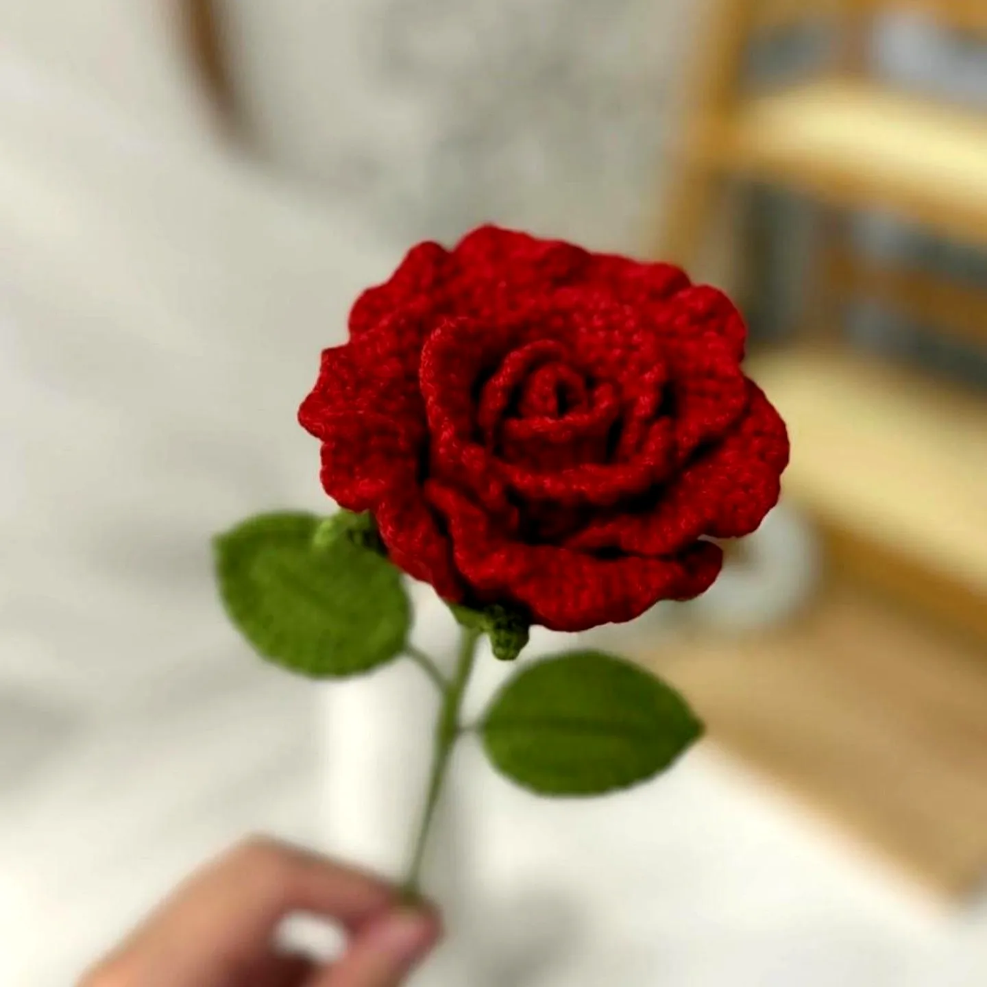 Vibrant Red Crochet Rose with Green Leaves