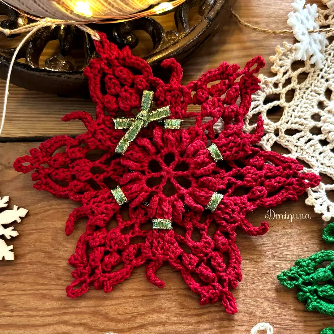 Vibrant Red Crochet Snowflake with Green Embellishments